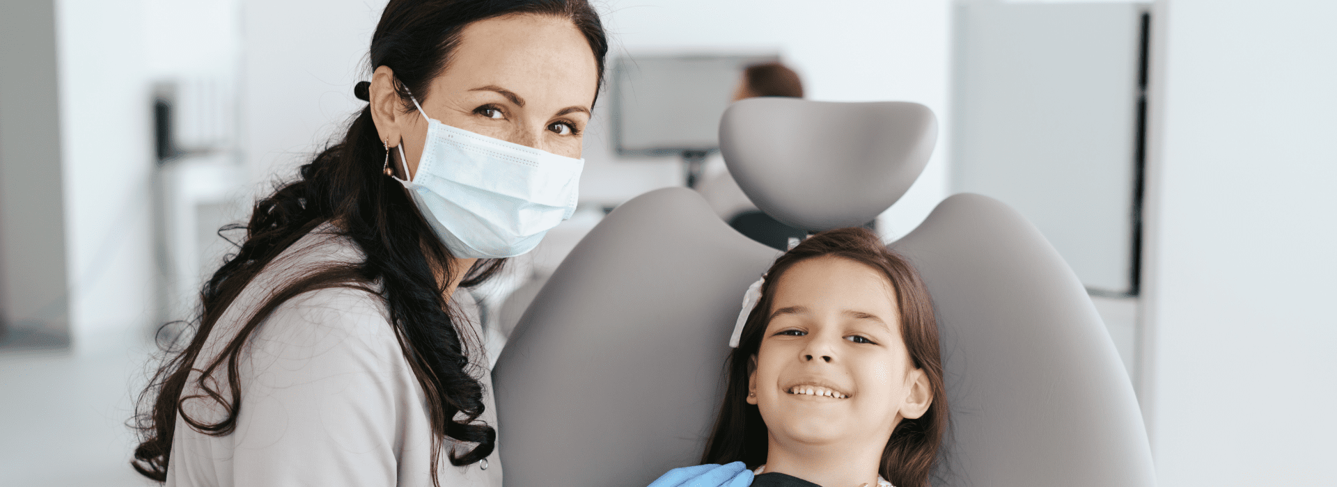 little-beautiful-girl-dentist-looking-smiling